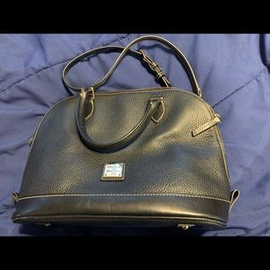 Black leather with red inside. Detailed stitching, in perfect condition nwot.